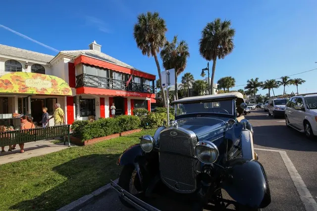 a view of a cafe with sitting area
