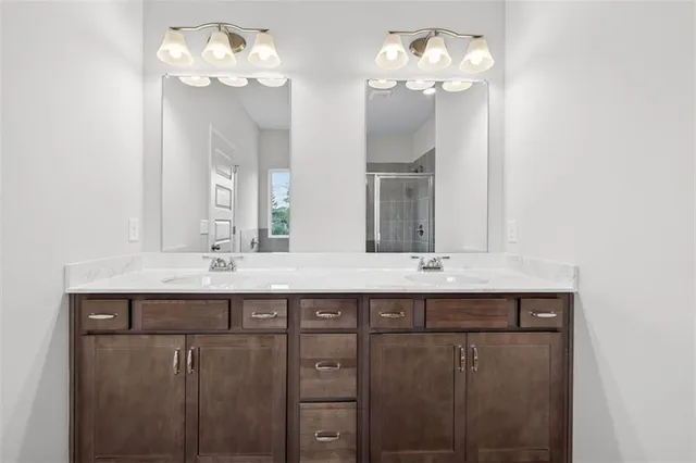 a white bath tub sitting next to a shower
