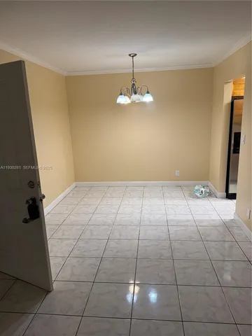 a view of an empty room with a bathroom