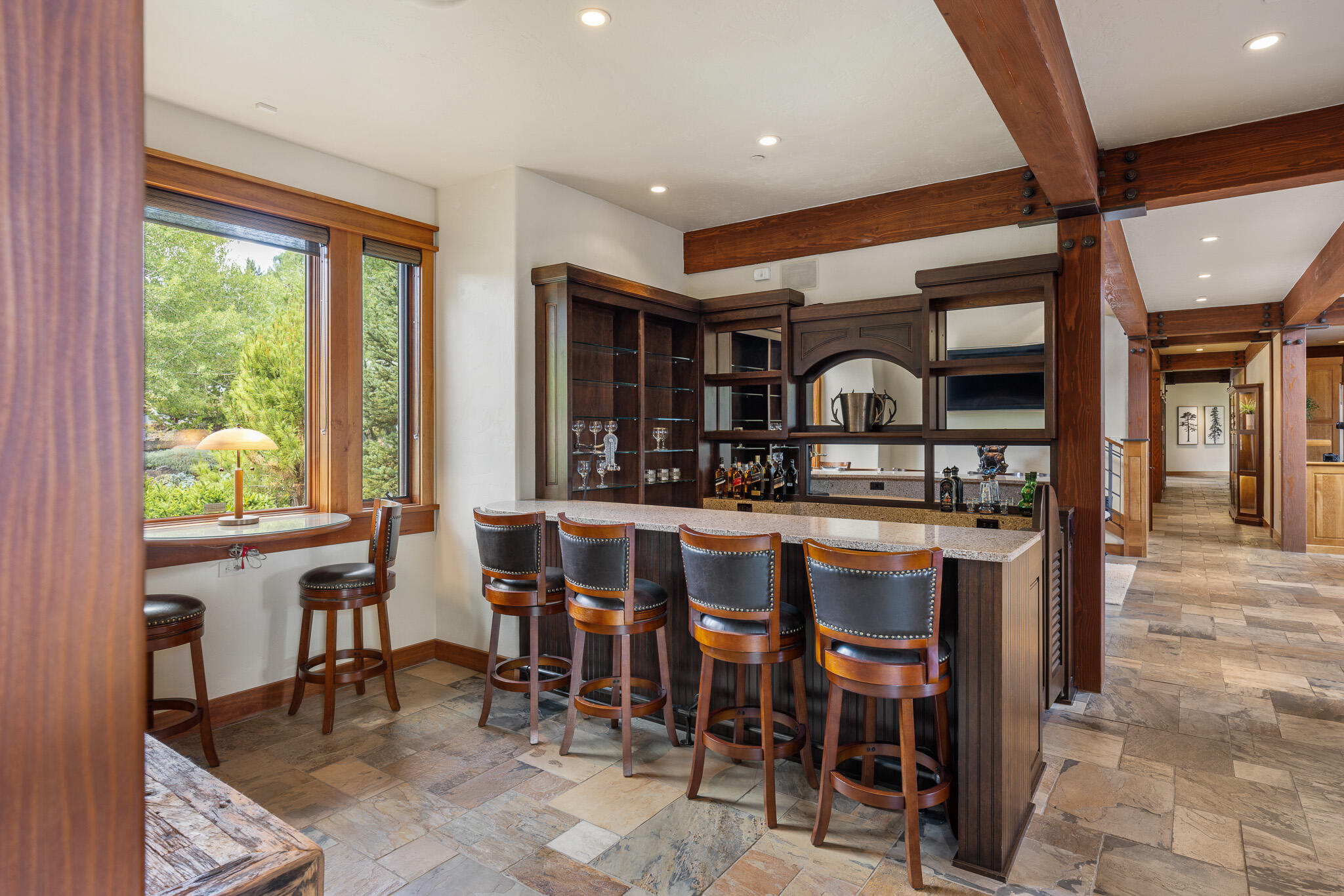 18883 Sutherland Court Bend, OR 97702 - Photo 20 of 70 A custom cherry bar with seating for four?crafted for conversation, celebration, and Central Oregon hospitality.