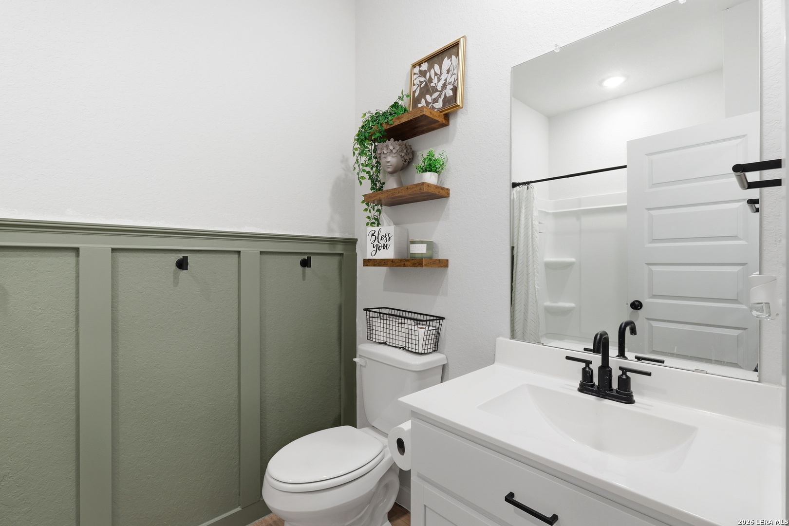 3523 Rancho Grande San Antonio, TX 78224 - Photo 5 of 22 a bathroom with a sink a toilet and shower