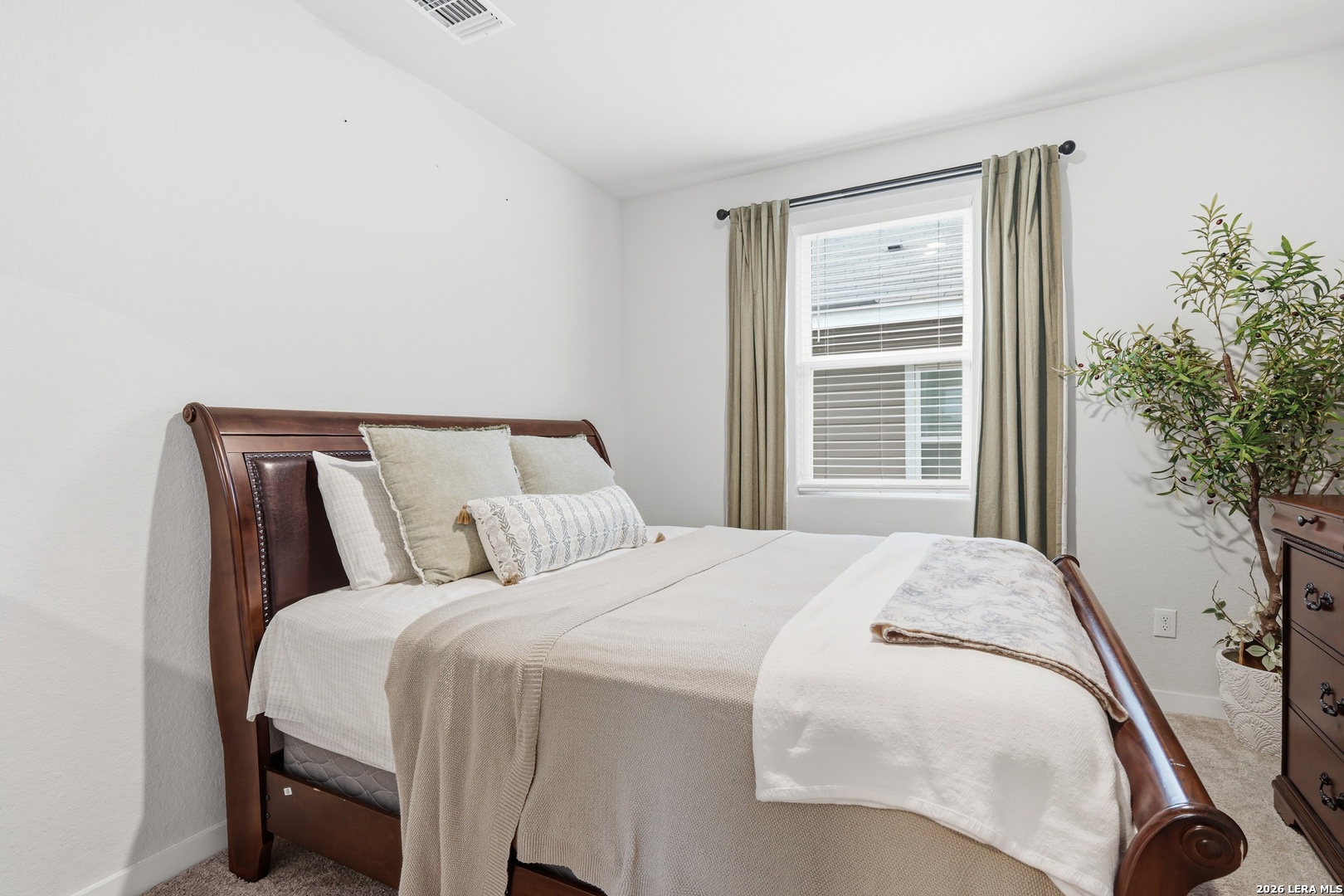3523 Rancho Grande San Antonio, TX 78224 - Photo 6 of 22 a large bed sitting in a bedroom next to a window