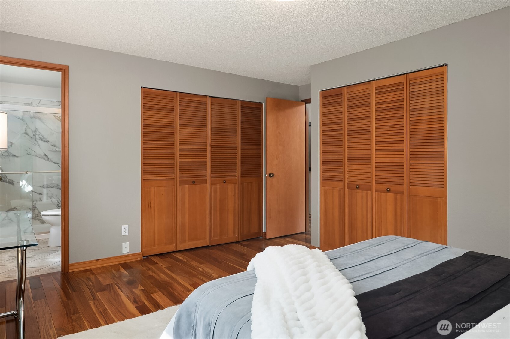21331 2nd Avenue Southeast Bothell, WA 98021 - Photo 14 of 34 a bedroom with a bed and wooden floor
