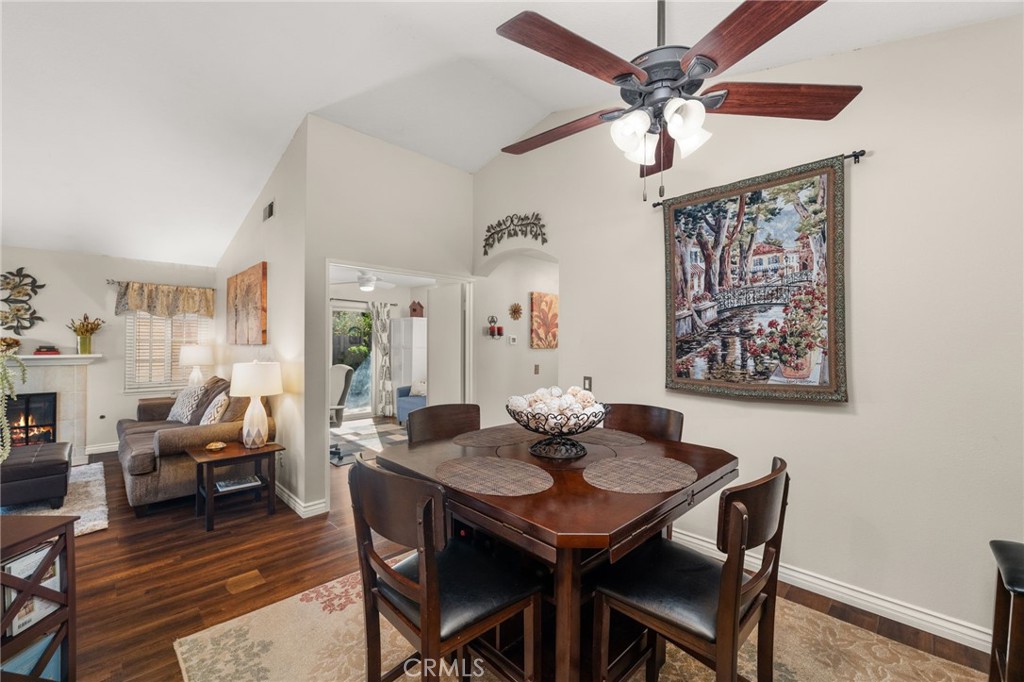 8576 Creekside Place Rancho Cucamonga, CA 91730 - Photo 11 of 37 a view of a dining room with furniture wooden floor and a chandelier