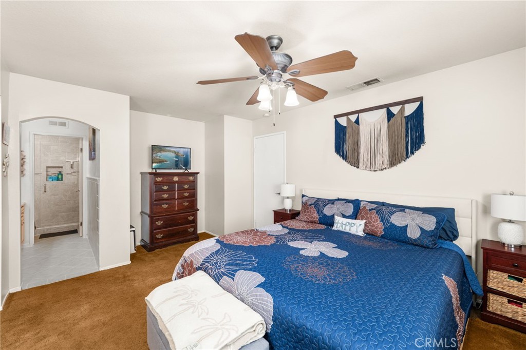 8576 Creekside Place Rancho Cucamonga, CA 91730 - Photo 19 of 37 a bedroom with a bed and wooden floor