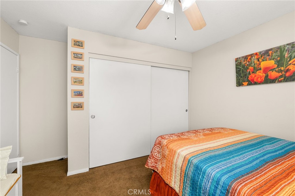 8576 Creekside Place Rancho Cucamonga, CA 91730 - Photo 23 of 37 a bedroom with a bed and a painting on the wall