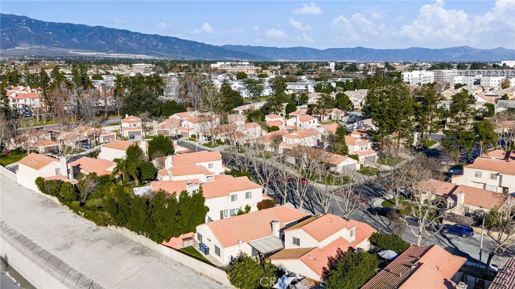 8576 Creekside Place Rancho Cucamonga, CA 91730 - Photo 35 of 37 an aerial view of residential houses with outdoor space and river