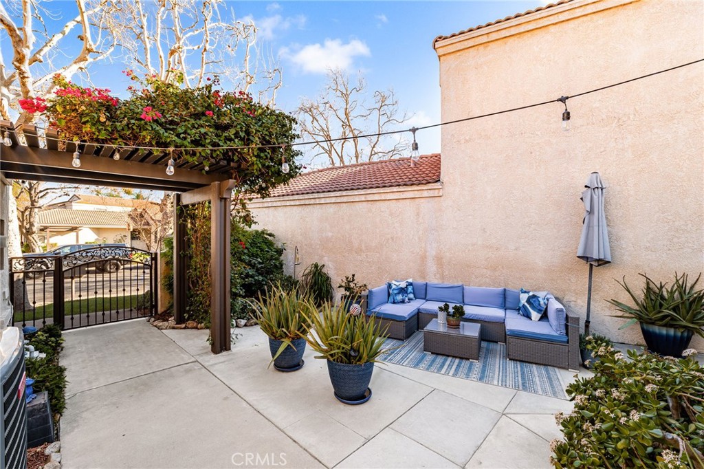 8576 Creekside Place Rancho Cucamonga, CA 91730 - Photo 6 of 37 a view of a patio with dining table and chairs potted plants