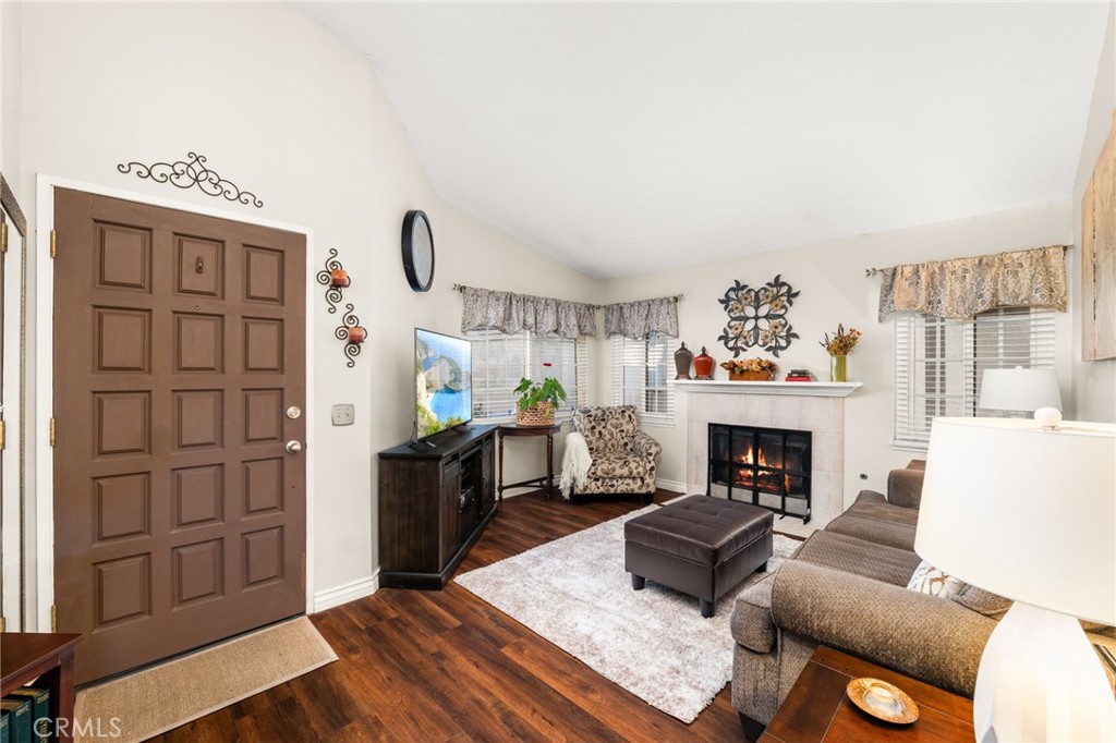 8576 Creekside Place Rancho Cucamonga, CA 91730 - Photo 8 of 37 a living room with furniture and a fireplace