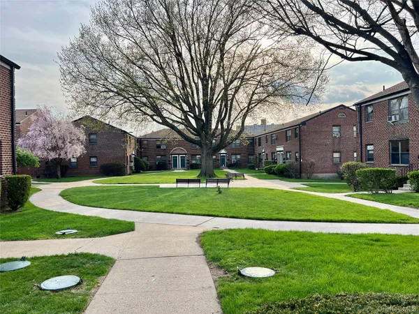 a view of house with a garden