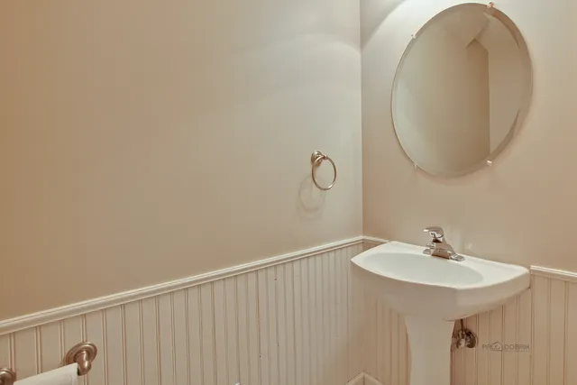 a bathroom with a sink and mirror