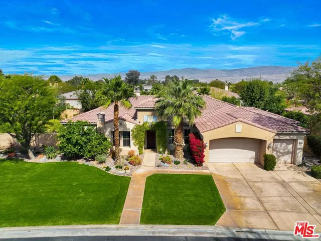 a aerial view of a house with a yard
