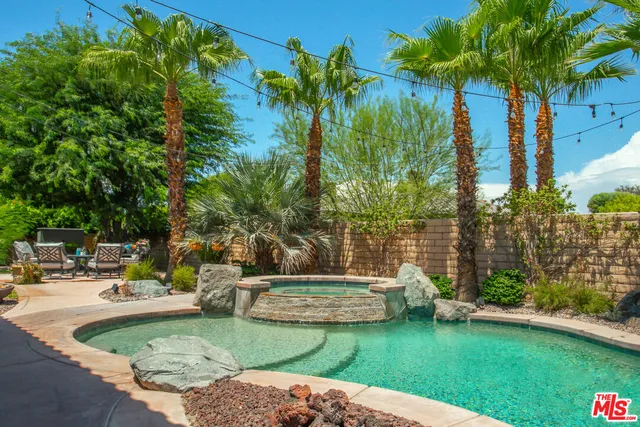 a garden view with a fountain