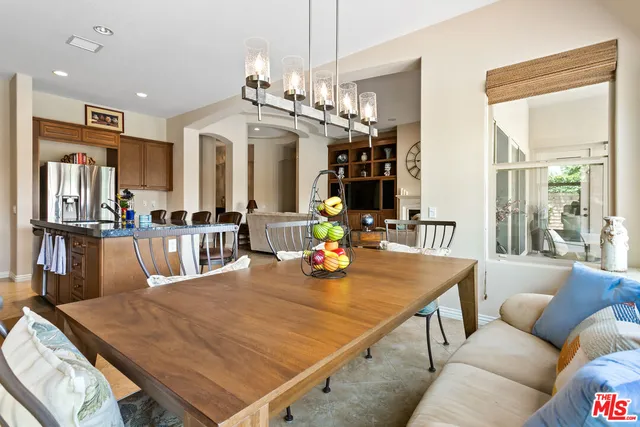 a living room with dining table