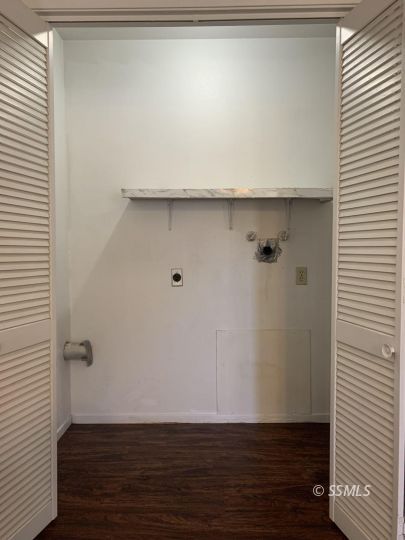 345 South Fountain Street Ridgecrest, CA 93555 - Photo 8 of 24 a view of an empty room with wooden floor