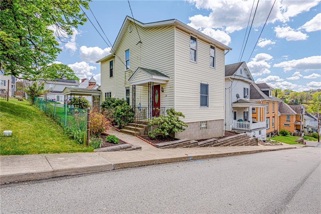 24 Butler Avenue Manor, PA 15665 - Photo 1 of 19 a front view of a house with garden