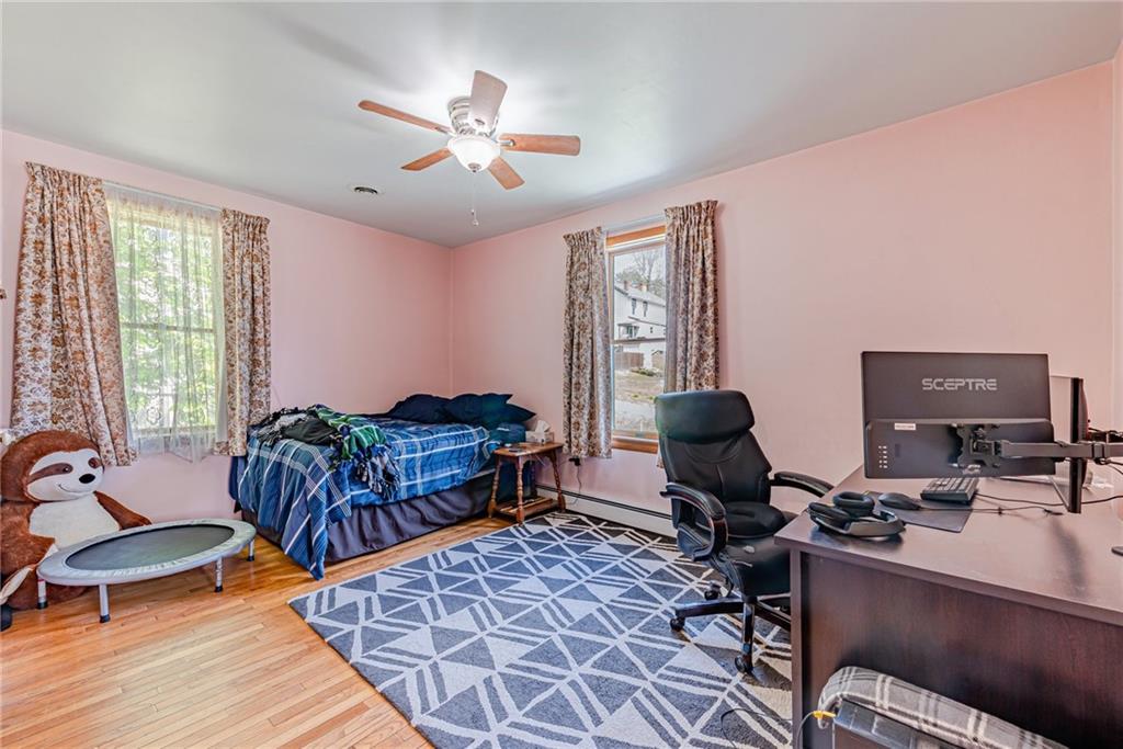 24 Butler Avenue Manor, PA 15665 - Photo 12 of 19 a living room with furniture and wooden floor
