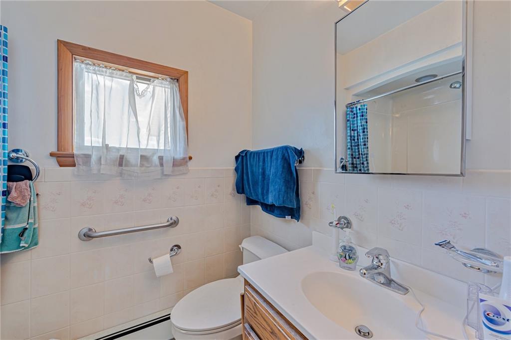 24 Butler Avenue Manor, PA 15665 - Photo 14 of 19 a bathroom with a sink toilet and mirror