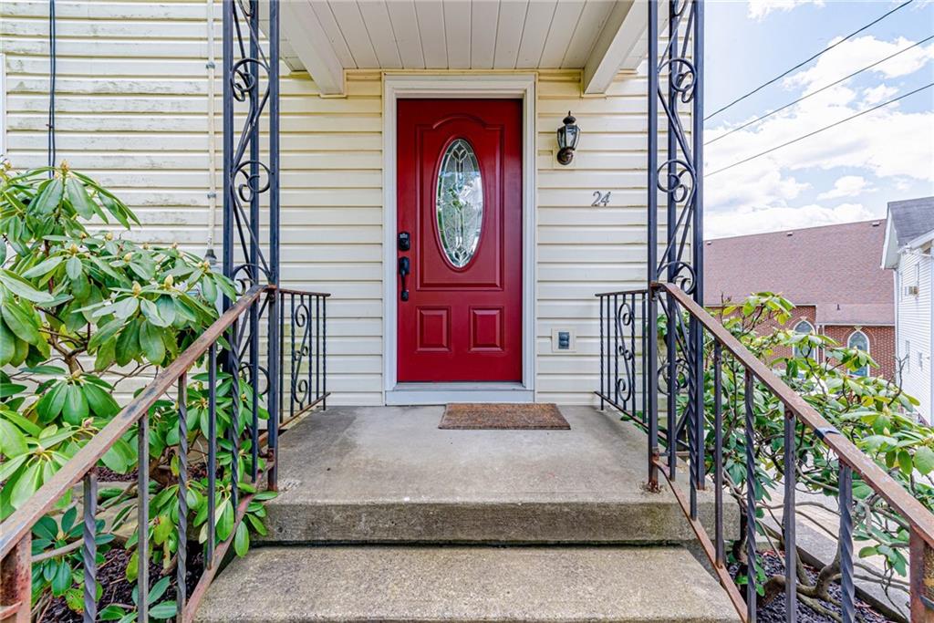 24 Butler Avenue Manor, PA 15665 - Photo 2 of 19 a front view of a house with garden