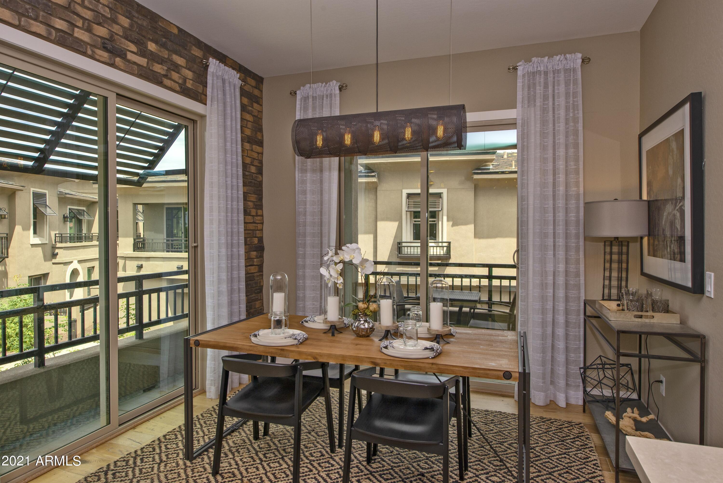 6565 East Thomas Road, Unit 1042 Scottsdale, AZ 85251 - Photo 7 of 22 a kitchen with a table and chairs in it