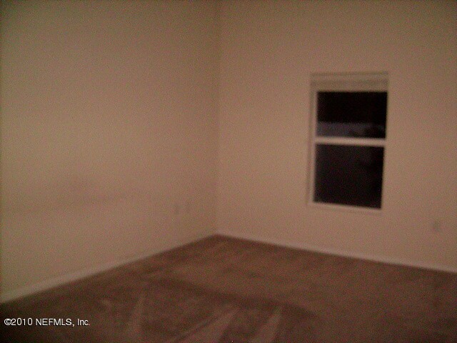 7920 Merrill Road, Unit 506 Jacksonville, FL 32277 - Photo 6 of 11 MASTER BED ROOM
