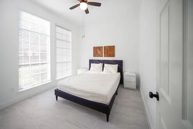 a bathroom with a toilet a sink and a mirror