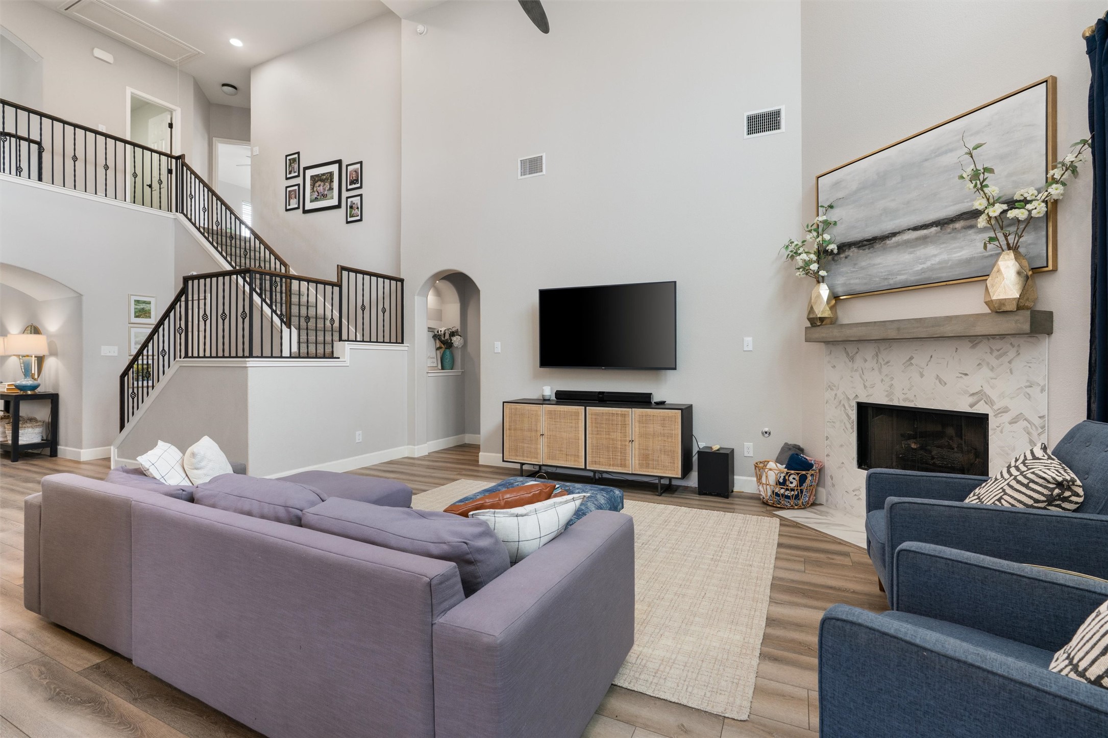 144 Copper Lake Lane Georgetown, TX 78628 - Photo 12 of 39 a living room with furniture and a flat screen tv