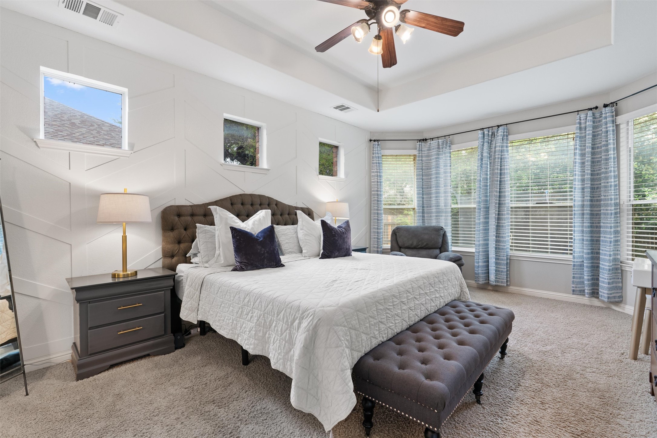 144 Copper Lake Lane Georgetown, TX 78628 - Photo 14 of 39 a bedroom with bed and a large window