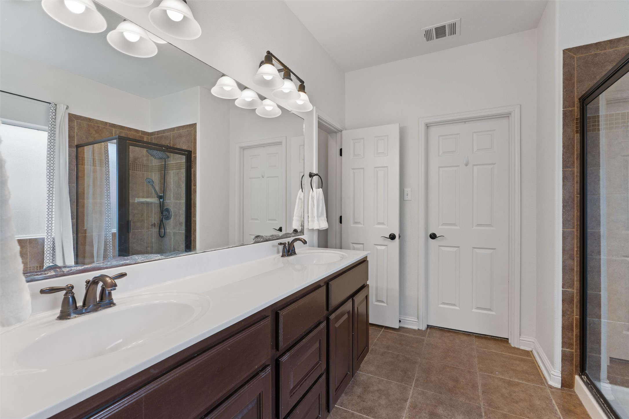 144 Copper Lake Lane Georgetown, TX 78628 - Photo 15 of 39 a bathroom with a sink a vanity and a mirror