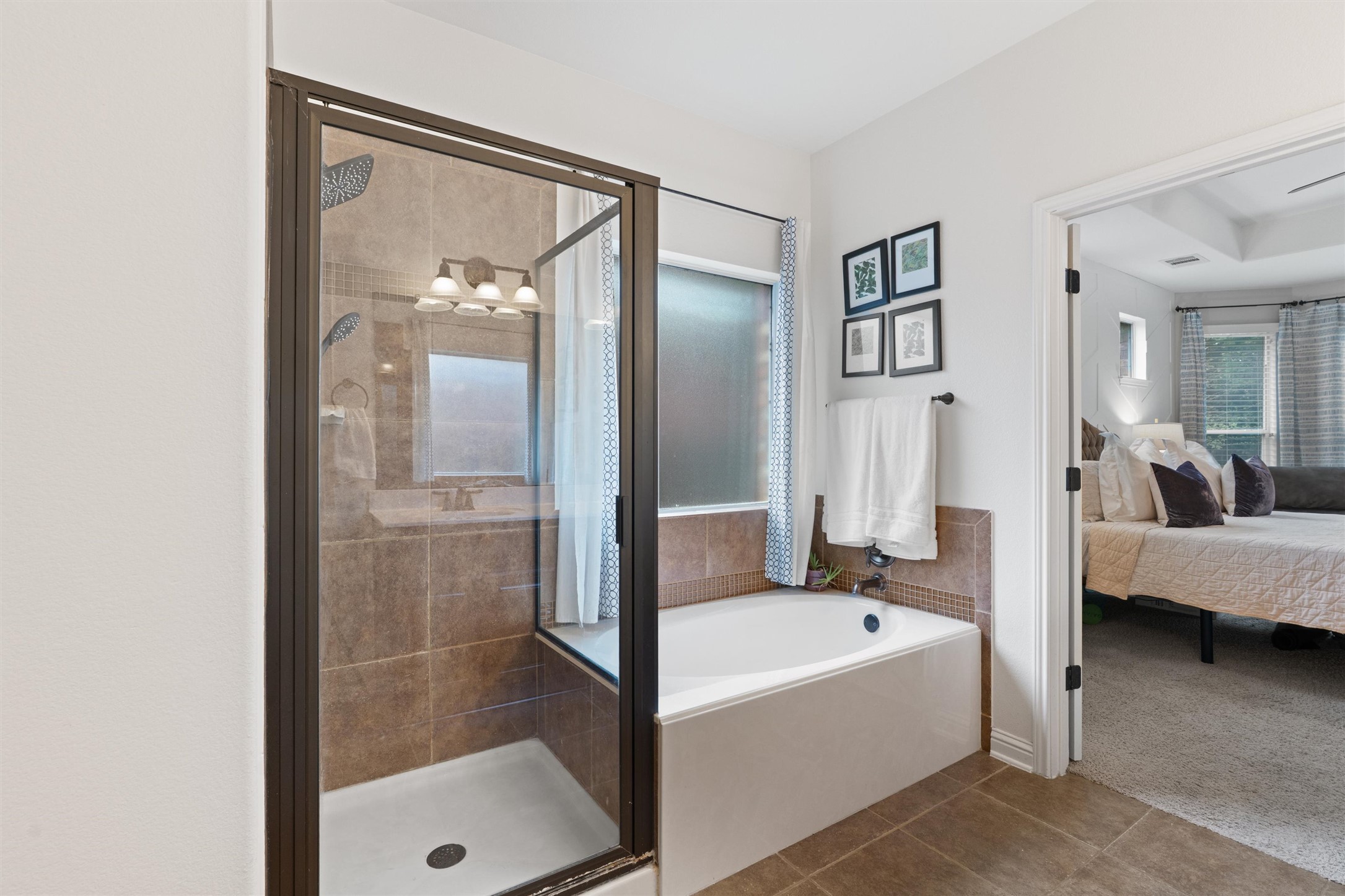 144 Copper Lake Lane Georgetown, TX 78628 - Photo 16 of 39 a bathroom with a tub shower and sink