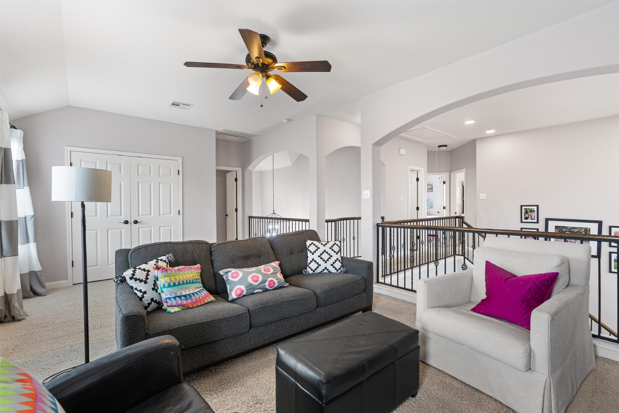 144 Copper Lake Lane Georgetown, TX 78628 - Photo 20 of 39 a living room with furniture and a chandelier