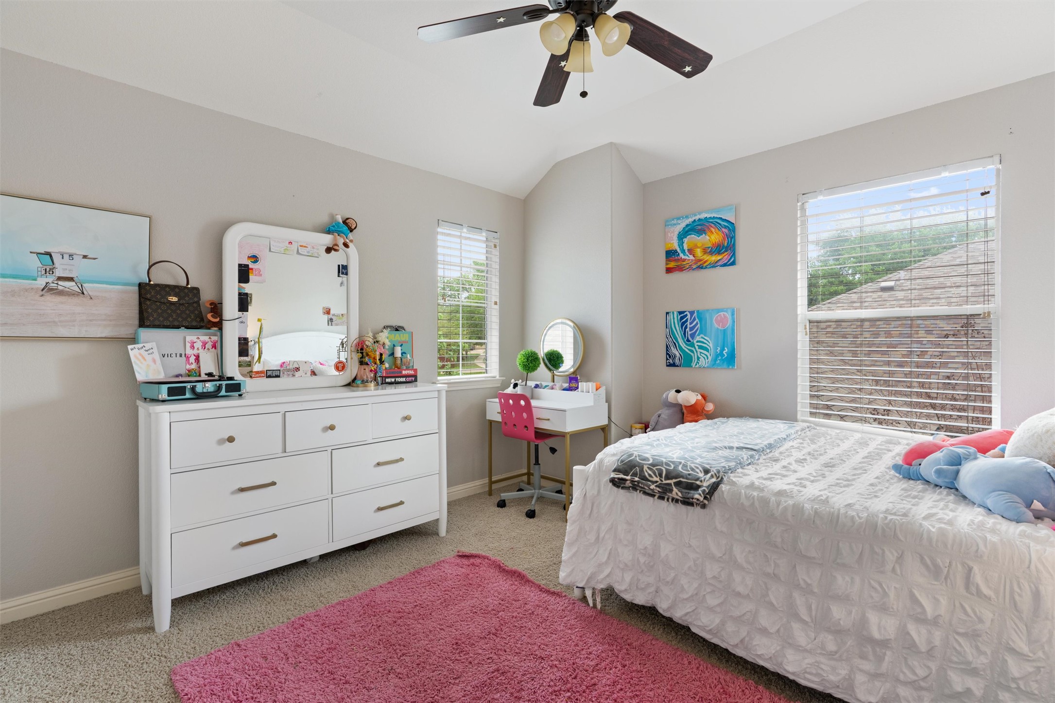 144 Copper Lake Lane Georgetown, TX 78628 - Photo 24 of 39 a bedroom with a bed and a dresser in it