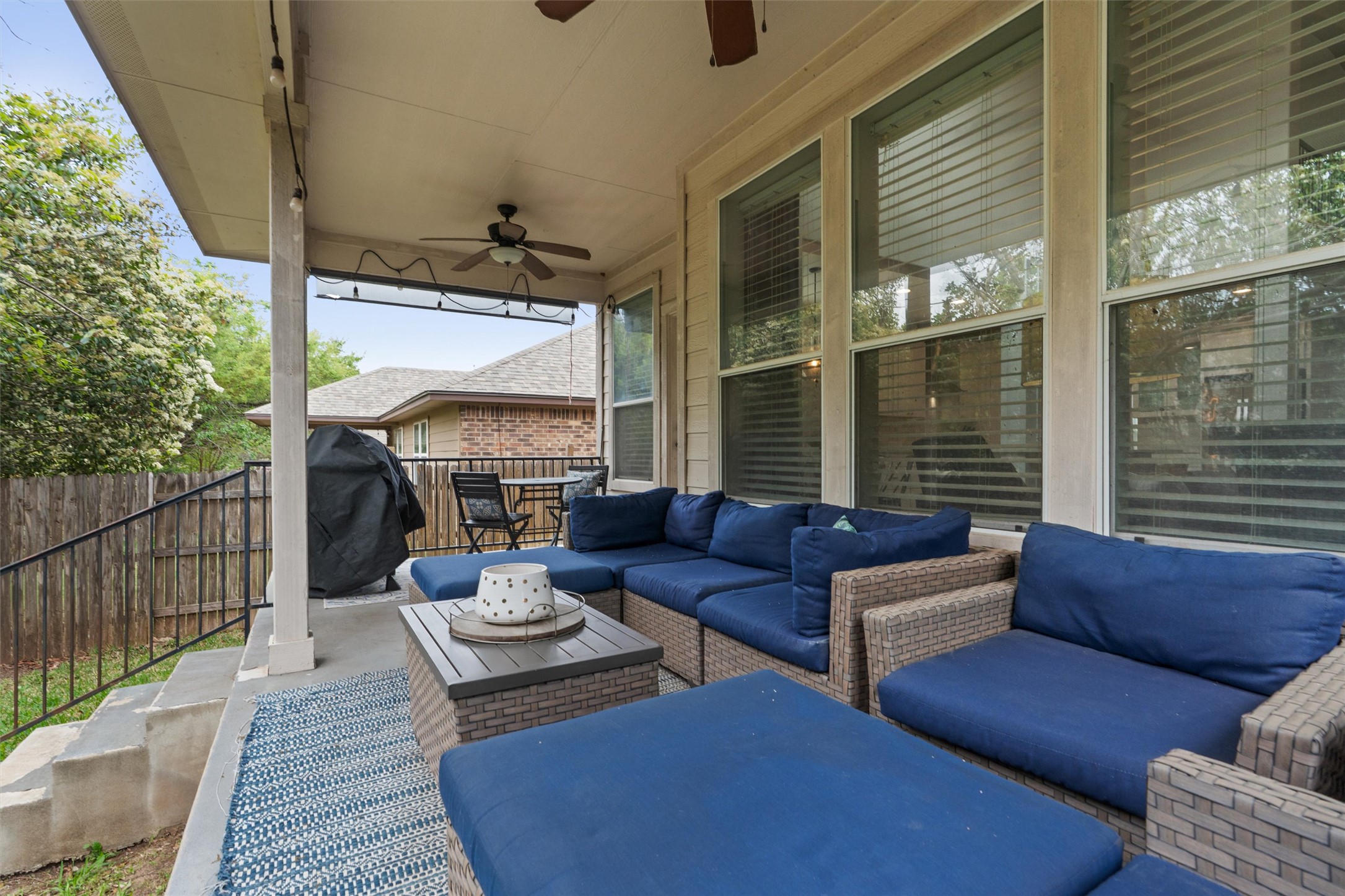 144 Copper Lake Lane Georgetown, TX 78628 - Photo 30 of 39 a outdoor living space with furniture and a potted plant