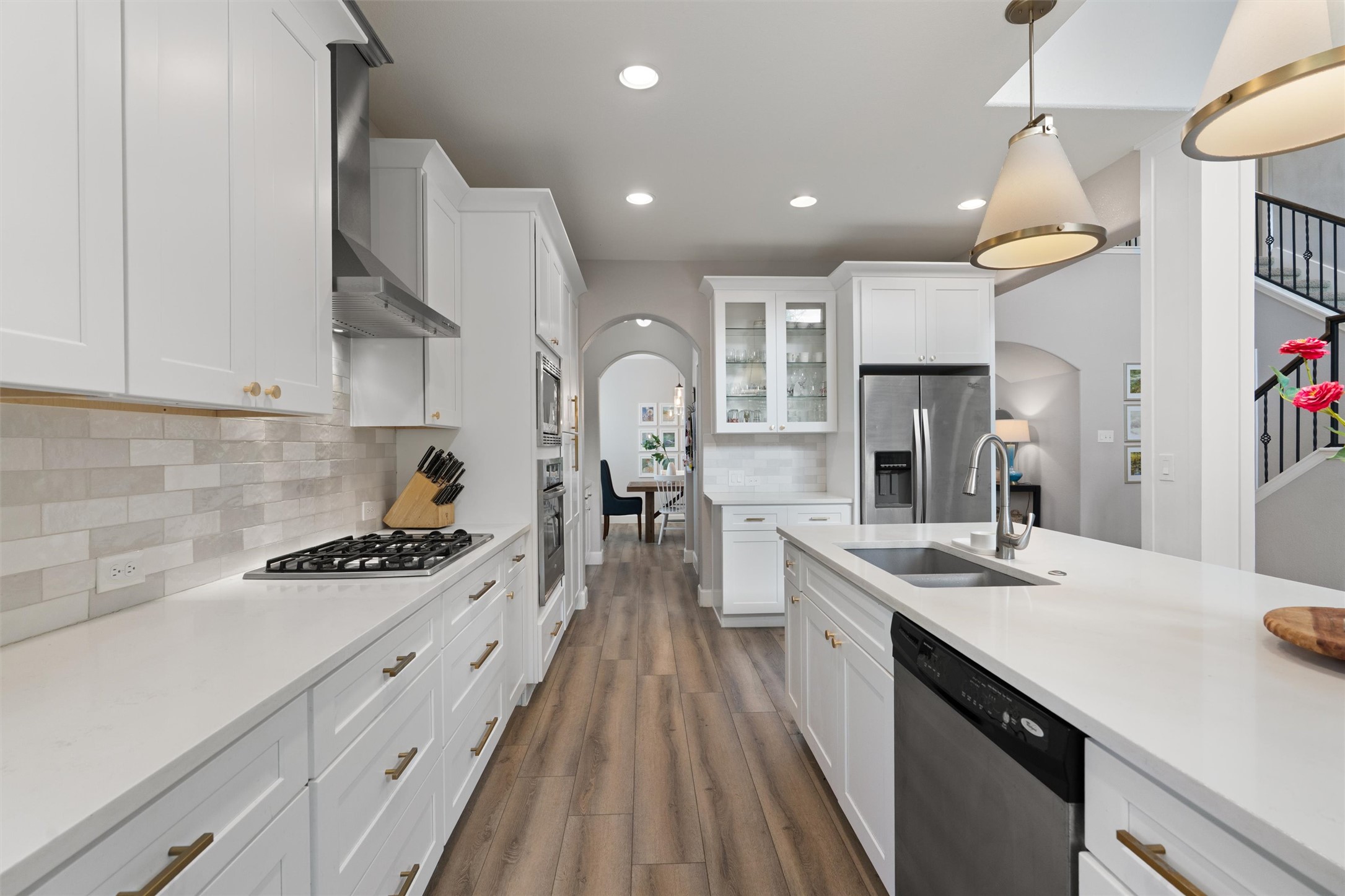 144 Copper Lake Lane Georgetown, TX 78628 - Photo 6 of 39 a kitchen with kitchen island stainless steel appliances a sink stove and cabinets
