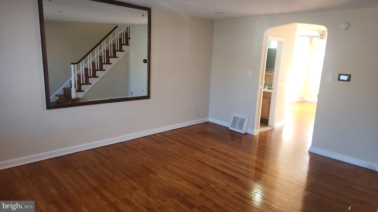 a view of an entryway with wooden floor