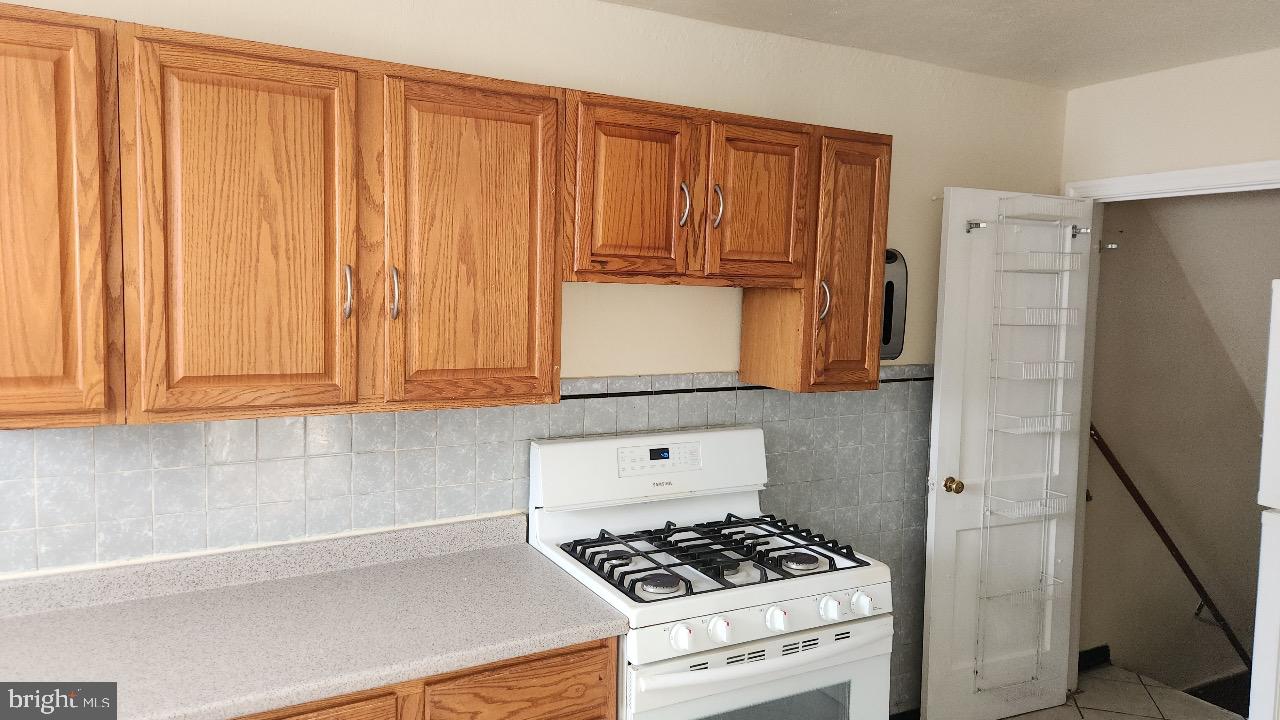 222 West Colonial Street Philadelphia, PA 19126 - Photo 5 of 18 a kitchen with a stove and a cabinet