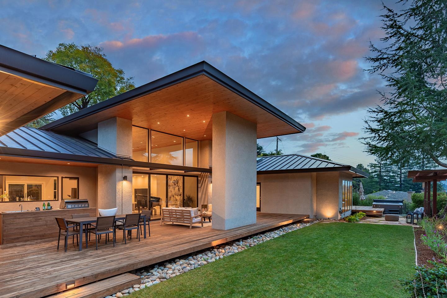 a backyard of a house with table and chairs