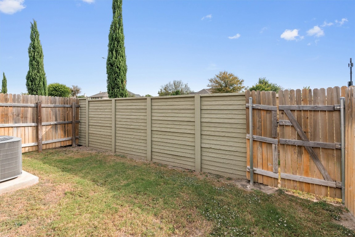2500 Forest Creek Drive, Unit 302 Round Rock, TX 78665 - Photo 25 of 27 a view of a backyard