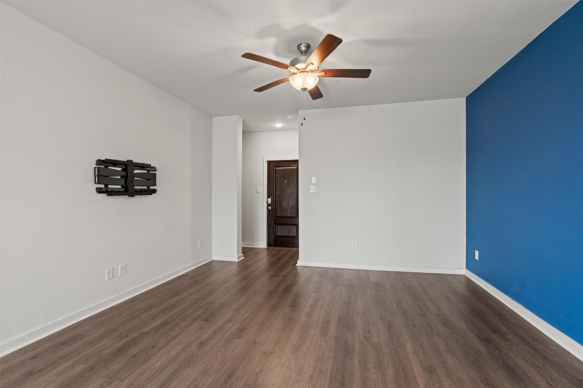 2500 Forest Creek Drive, Unit 302 Round Rock, TX 78665 - Photo 3 of 27 a view of an empty room with wooden floor