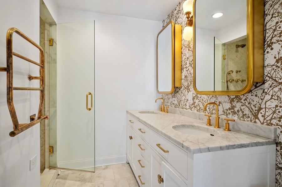 505 Ridge Road Kenilworth, IL 60043 - Photo 14 of 26 a bathroom with a granite countertop sink and a mirror