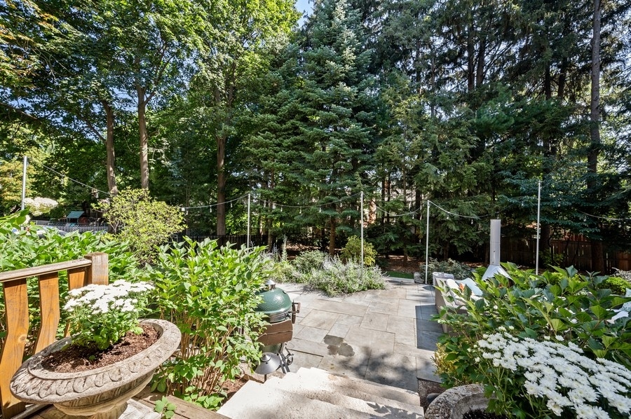 505 Ridge Road Kenilworth, IL 60043 - Photo 24 of 26 a view of a chair and table in the garden