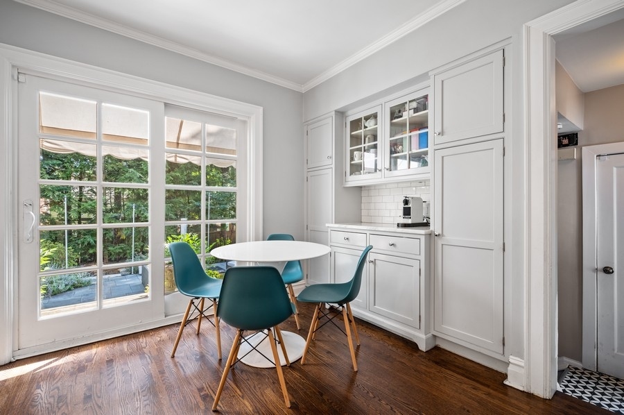 505 Ridge Road Kenilworth, IL 60043 - Photo 6 of 26 a view of a dining room with furniture window and wooden floor