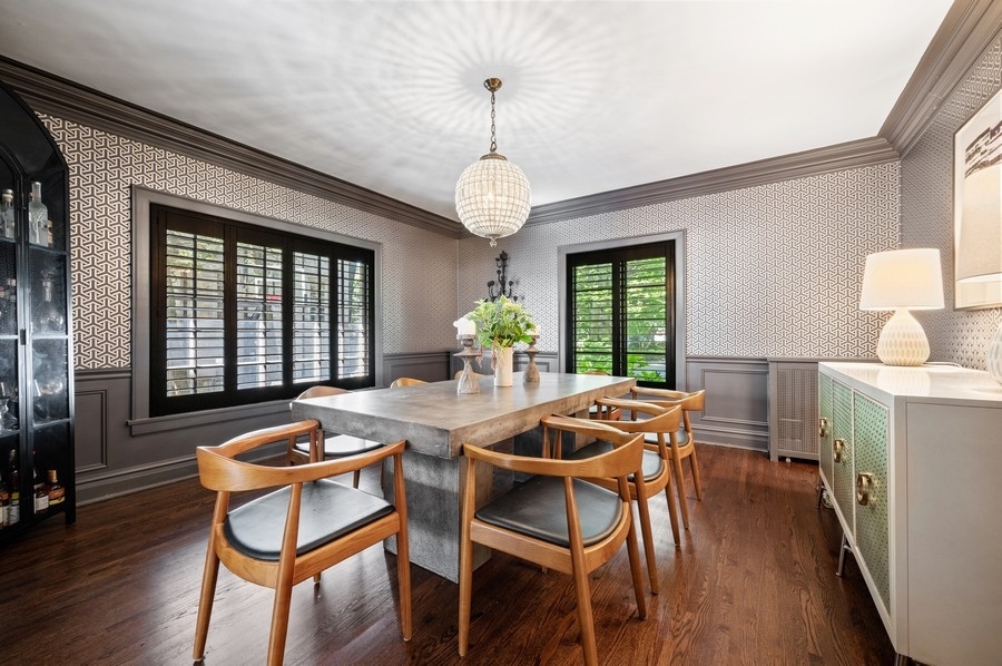 505 Ridge Road Kenilworth, IL 60043 - Photo 8 of 26 a dining room with furniture a chandelier and wooden floor