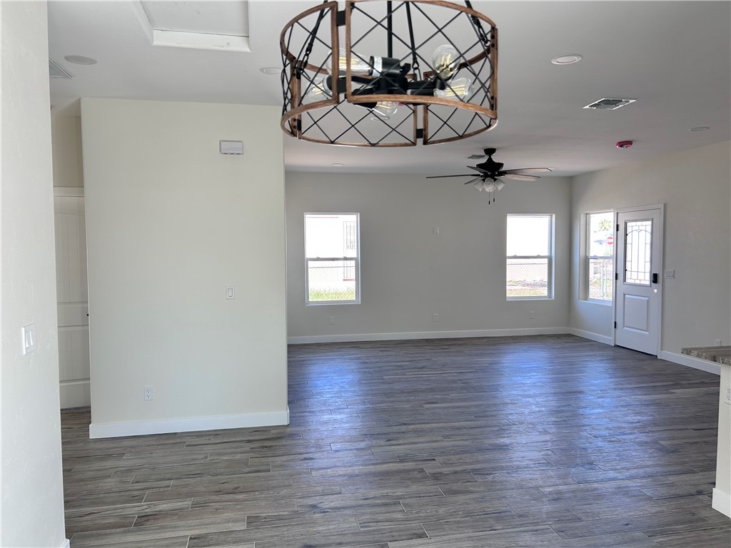 1266 Wilson Road Bullhead City, AZ 86442 - Photo 9 of 29 Spare room featuring recessed lighting and dark wood-style floors