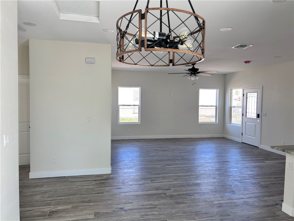1266 Wilson Road Bullhead City, AZ 86442 - Photo 10 of 29 Spare room featuring healthy amount of natural light, dark wood-style floors, and recessed lighting