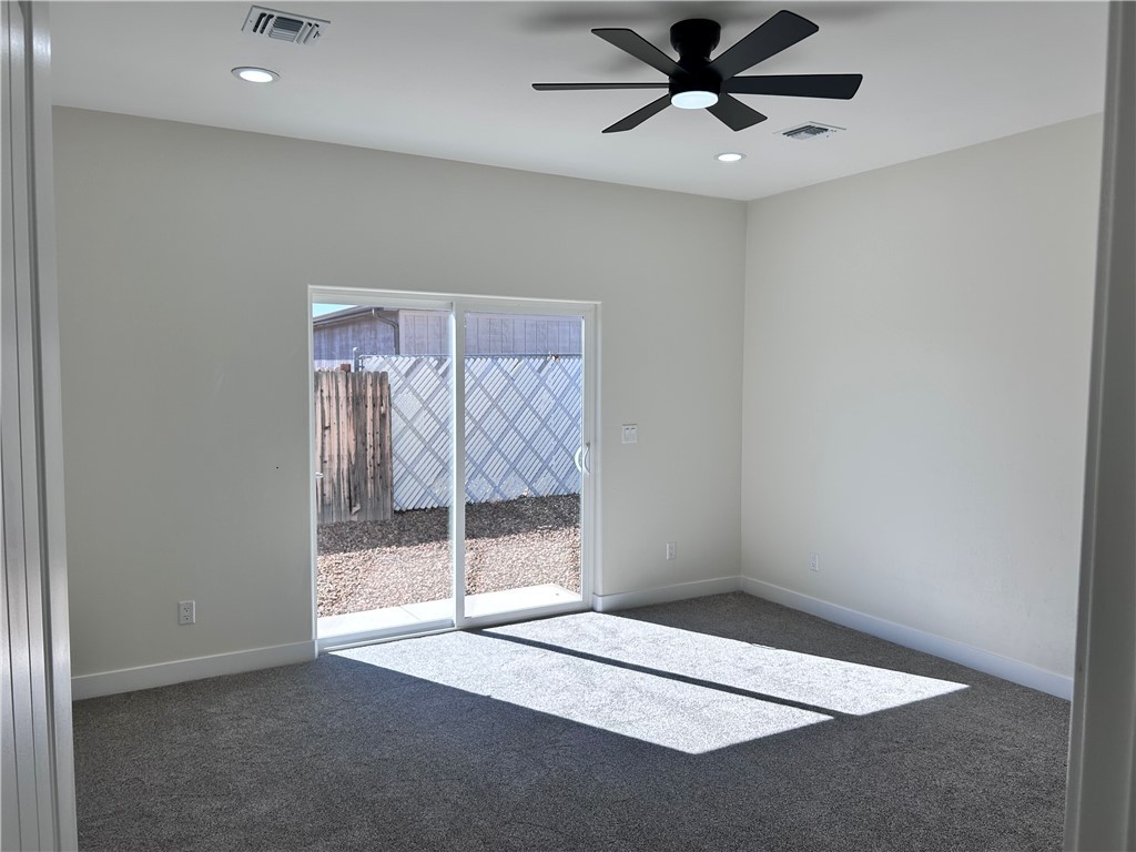 1266 Wilson Road Bullhead City, AZ 86442 - Photo 17 of 29 Carpeted spare room with recessed lighting and ceiling fan