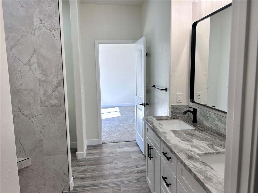 1266 Wilson Road Bullhead City, AZ 86442 - Photo 21 of 29 Full bathroom featuring double vanity and light wood finished floors