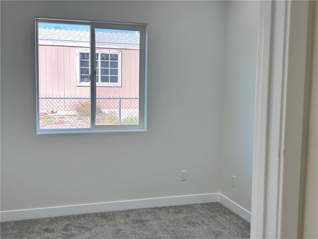 1266 Wilson Road Bullhead City, AZ 86442 - Photo 23 of 29 Carpeted empty room with baseboards