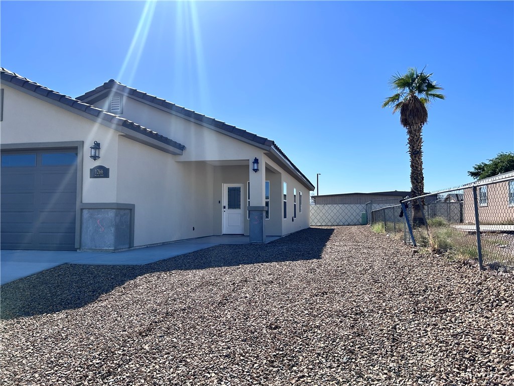 1266 Wilson Road Bullhead City, AZ 86442 - Photo 27 of 29 View of side of property with stucco siding