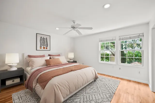 a bedroom with a large bed and a window